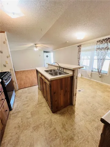 a kitchen with a stove and a sink