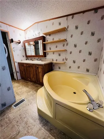 a bathroom with a bathtub and shower