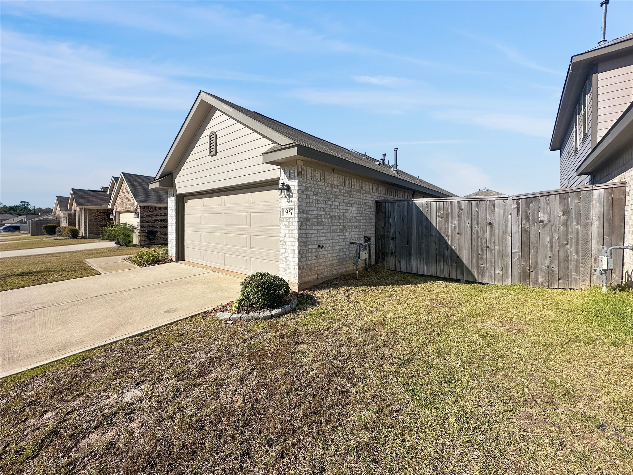 937 Silver Birch Branch Magnolia, TX 77354 - Photo 18 of 19 a house view with a backyard space