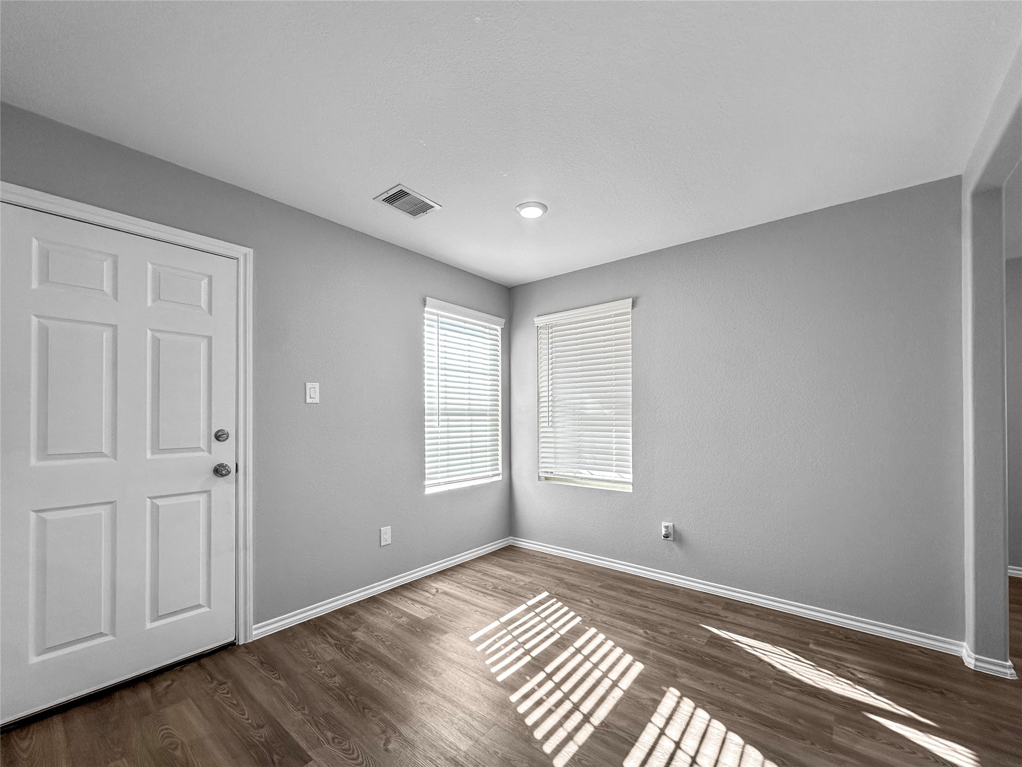937 Silver Birch Branch Magnolia, TX 77354 - Photo 3 of 19 a view of an empty room with wooden floor and a window