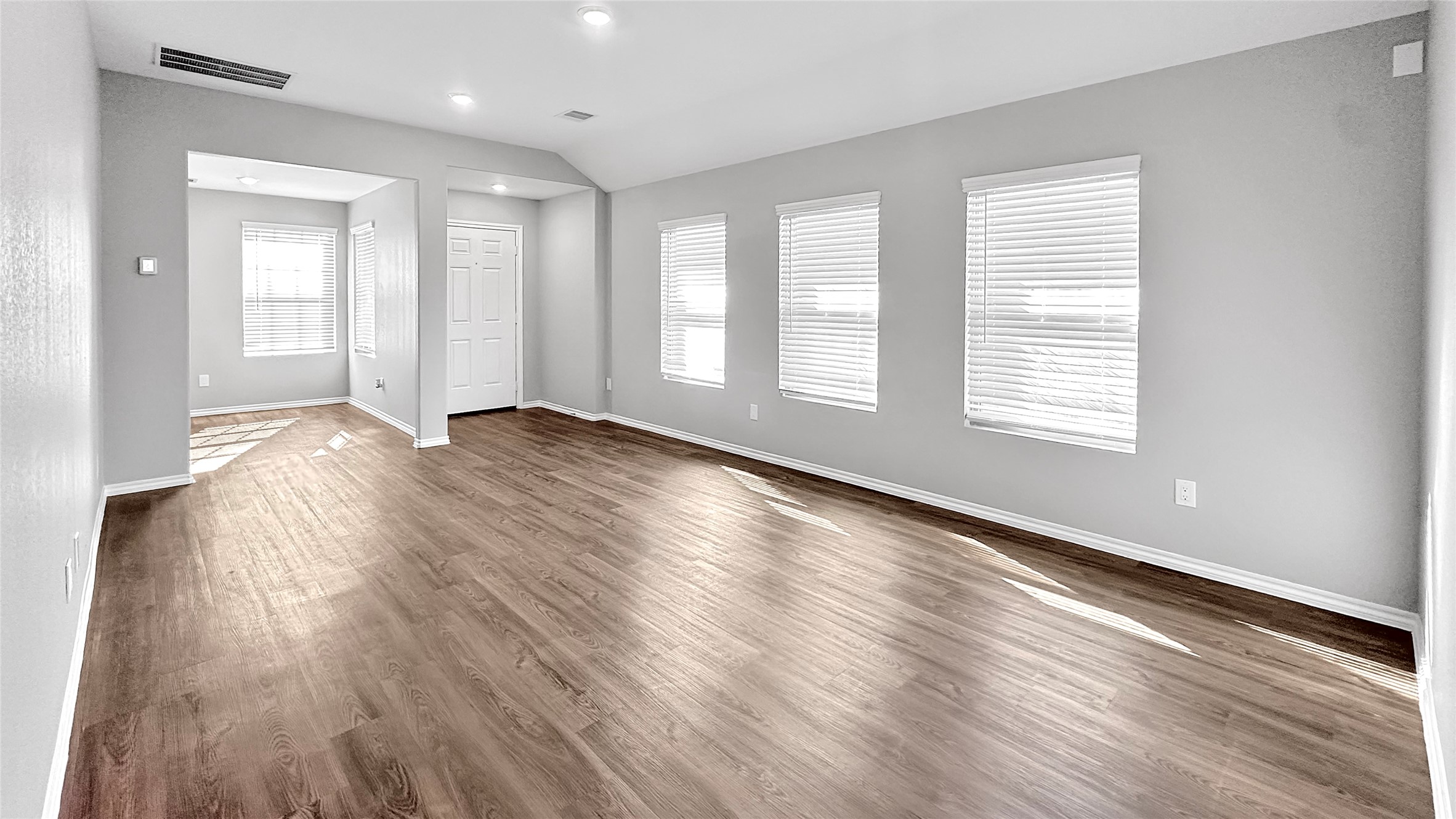 937 Silver Birch Branch Magnolia, TX 77354 - Photo 4 of 19 a view of an empty room with wooden floor and a window
