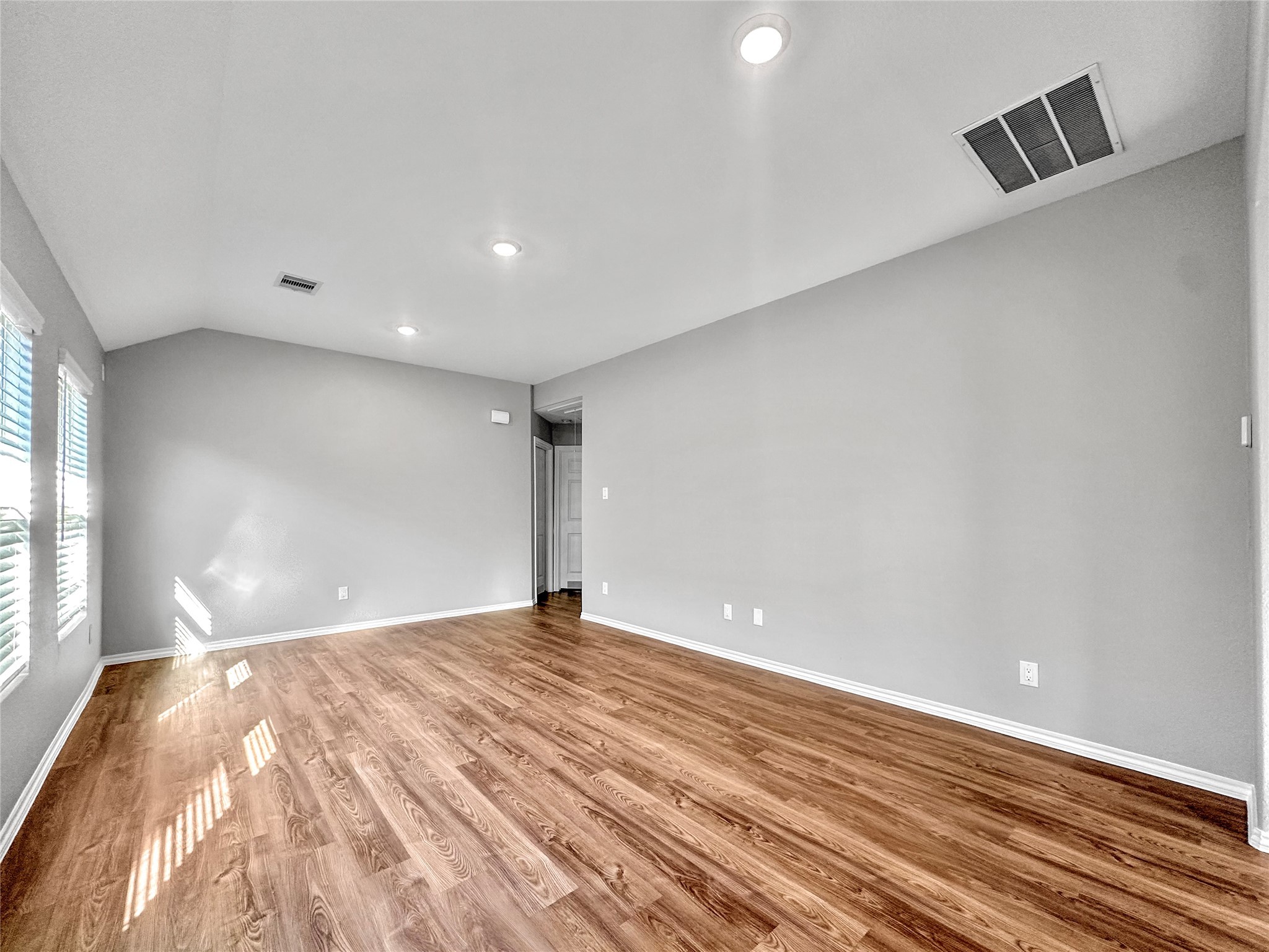 937 Silver Birch Branch Magnolia, TX 77354 - Photo 5 of 19 a view of an empty room with wooden floor and a window