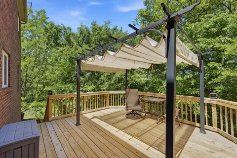 a view of a deck with furniture