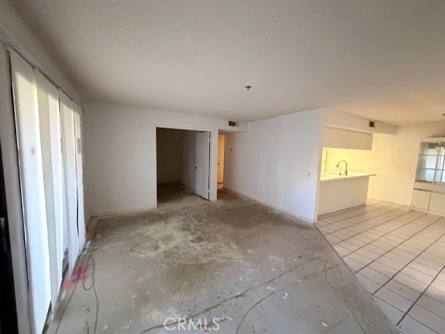 200 East Racquet Club Road, Unit 35 Palm Springs, CA 92262 - Photo 4 of 8 a view of an empty room and a bedroom
