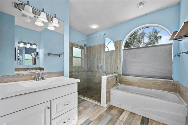 a bathroom with a shower and a sink