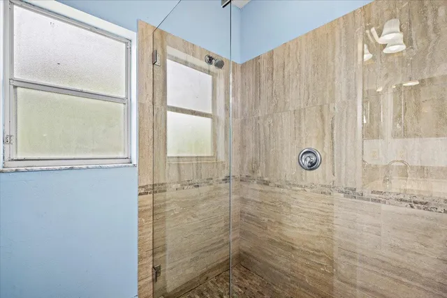 a bathroom with a sink a vanity and a mirror