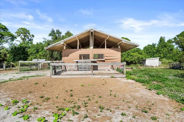a view of a patio with table and chairs