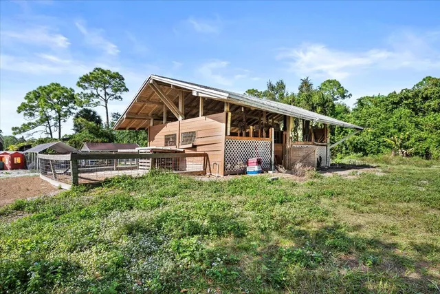 a view of dirt yard with a trees