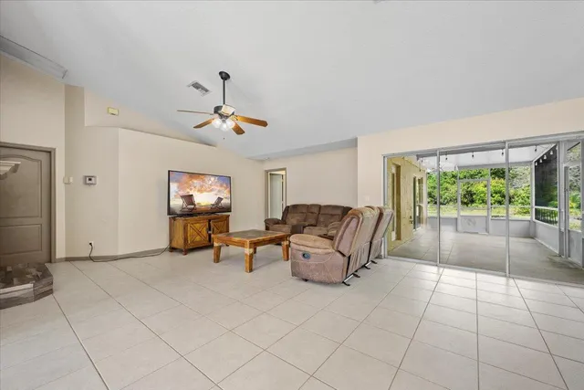 a large kitchen with granite countertop a large stove a sink a window and stainless steel appliances