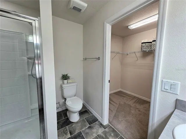 a bathroom with a glass door shower