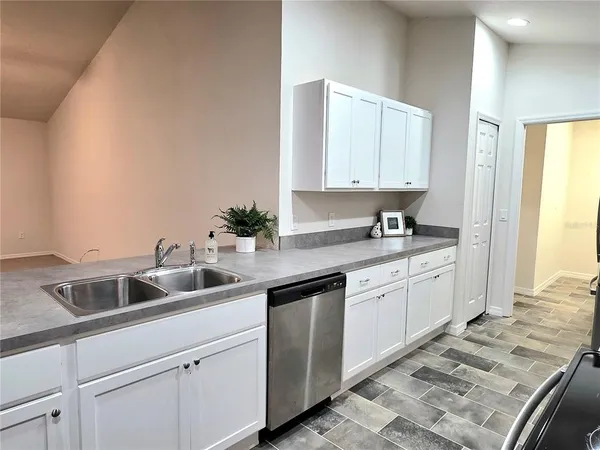 a kitchen with a sink and cabinets