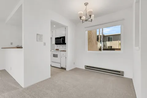 a view of a kitchen with a sink and dishwasher kitchen view