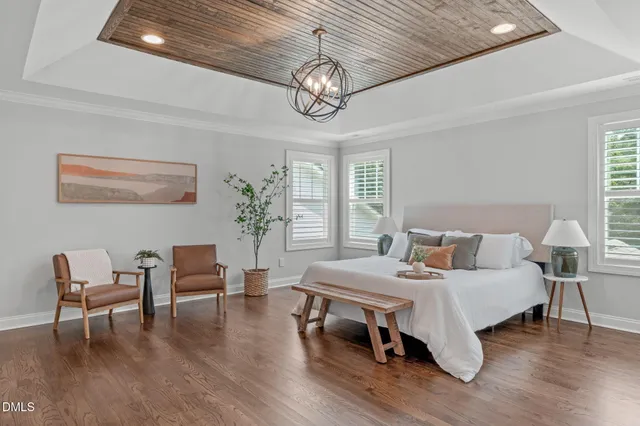a bedroom with furniture and a window