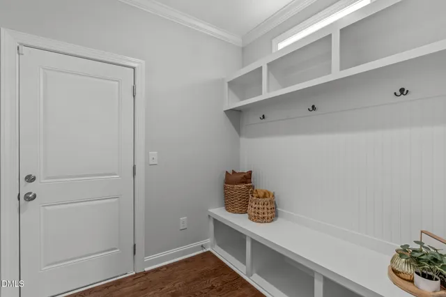 a view of storage and utility room with wooden floor