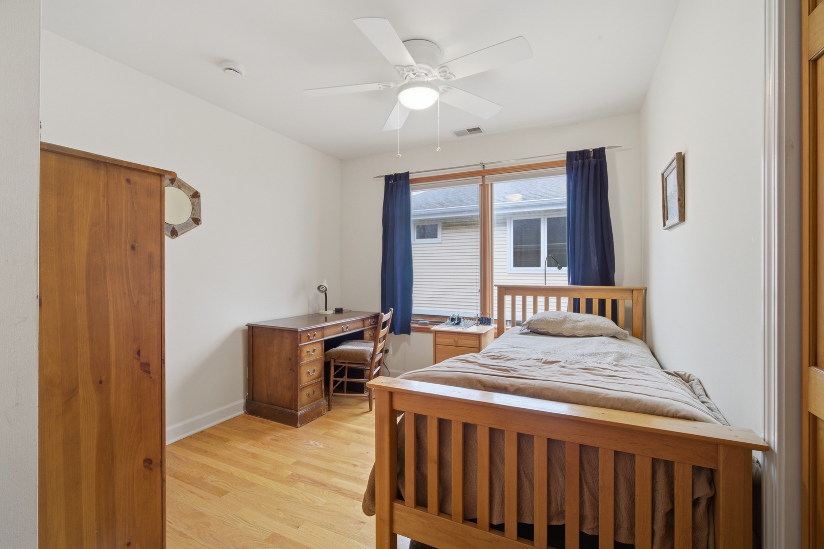 1917 Kiest Avenue Northbrook, IL 60062 - Photo 15 of 27 a bedroom with a bed and a chandelier