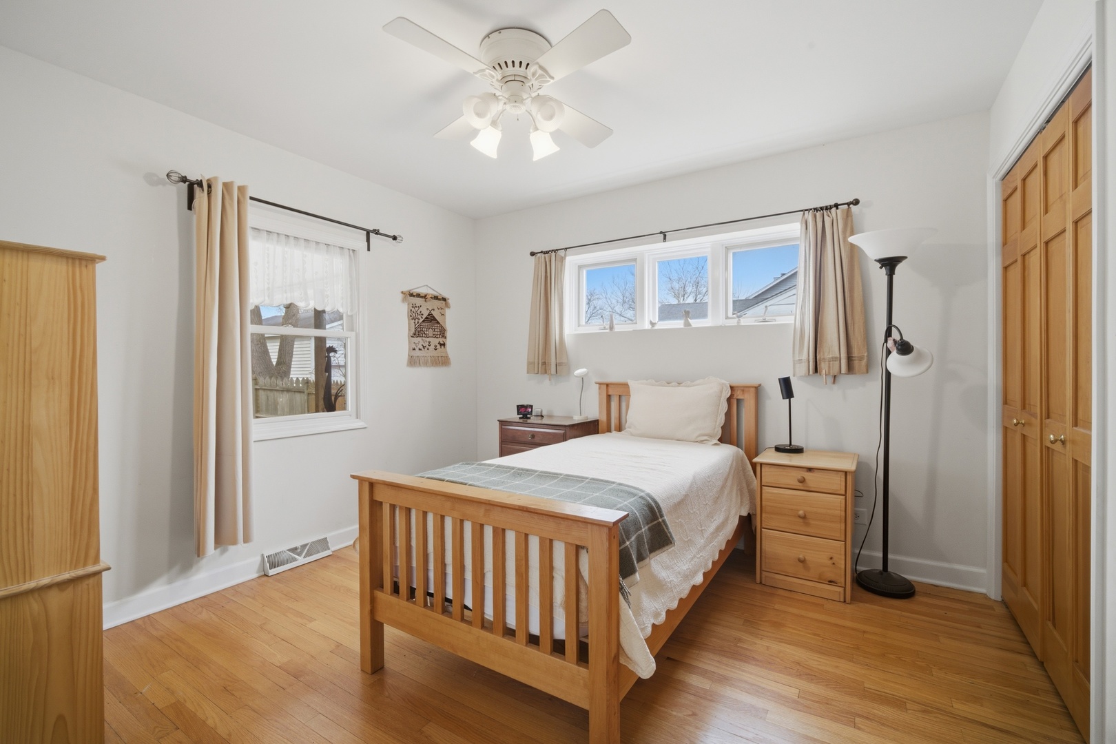 1917 Kiest Avenue Northbrook, IL 60062 - Photo 16 of 27 a bedroom with a bed and a chandelier