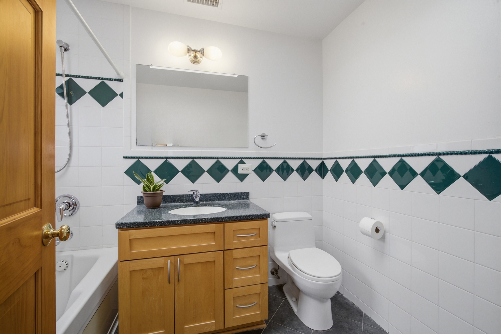 1917 Kiest Avenue Northbrook, IL 60062 - Photo 18 of 27 a bathroom with a granite countertop toilet and a sink