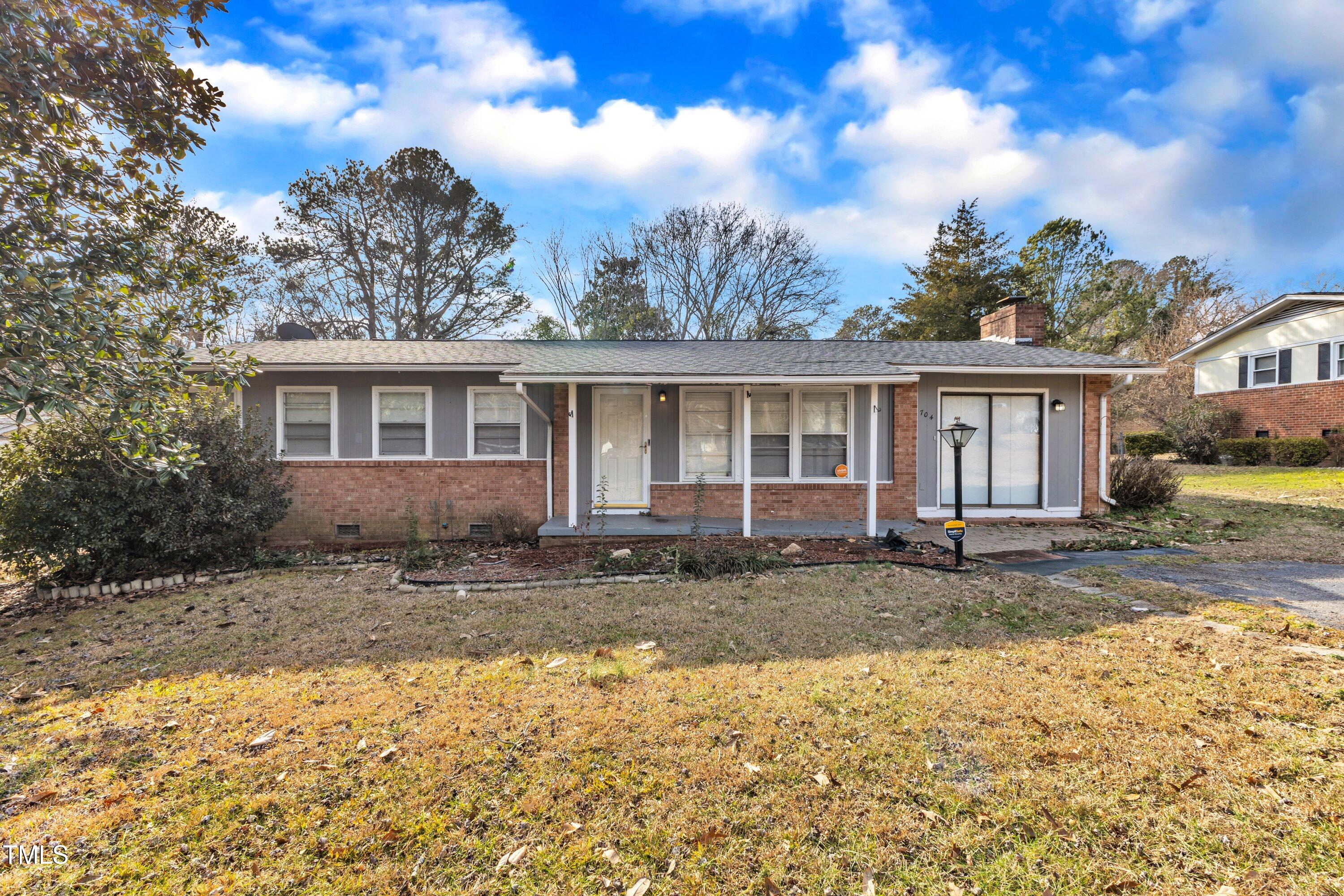 704 Sunnybrook Road Raleigh, NC 27610 - Photo 1 of 33 a front view of a house with a yard