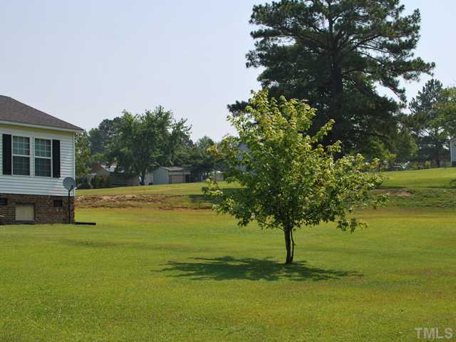 2445 Zacks Mill Road Angier, NC 27501 - Photo 14 of 15 a view of a swimming pool with an outdoor space and seating area