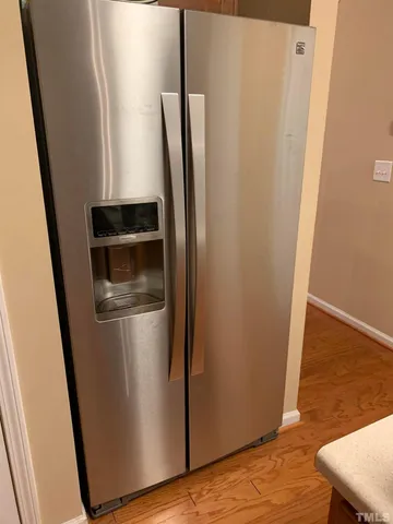 a view of a kitchen from a hallway