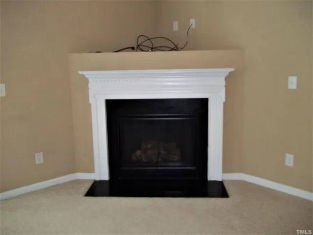a living room with a fireplace