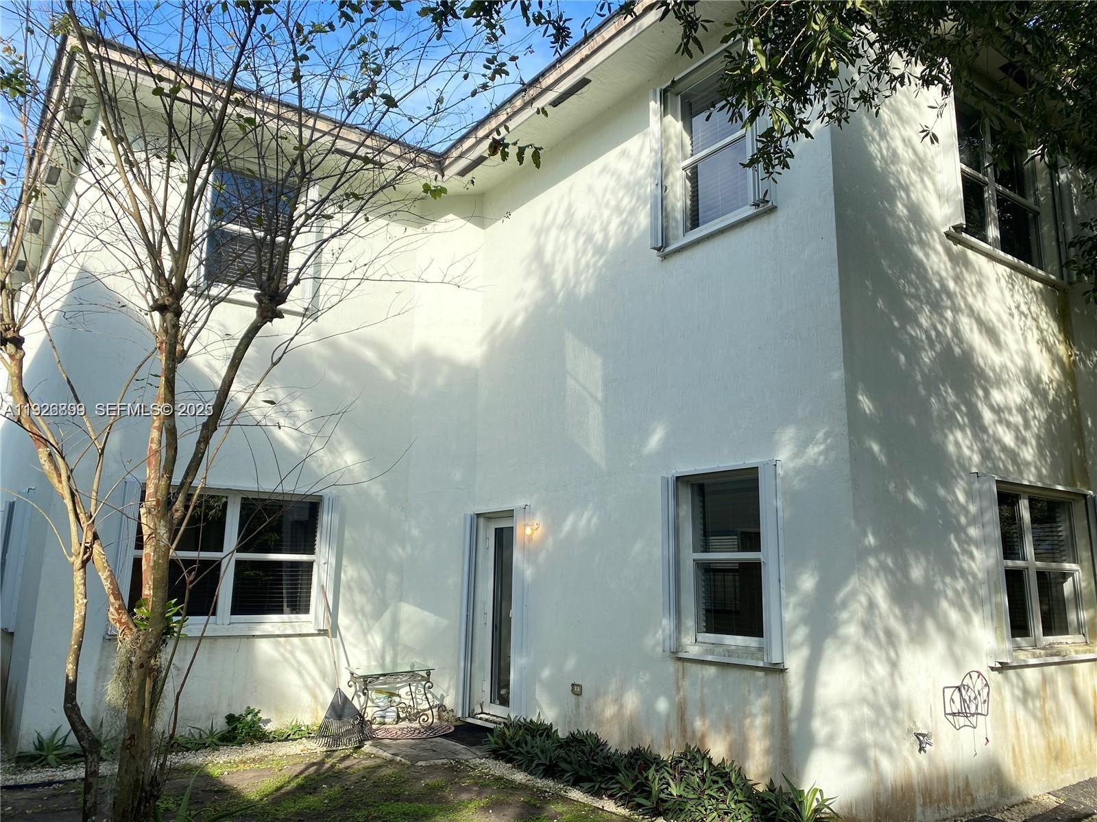 3616 Northeast 3rd Court Homestead, FL 33033 - Photo 11 of 11 a view of a house with a large tree
