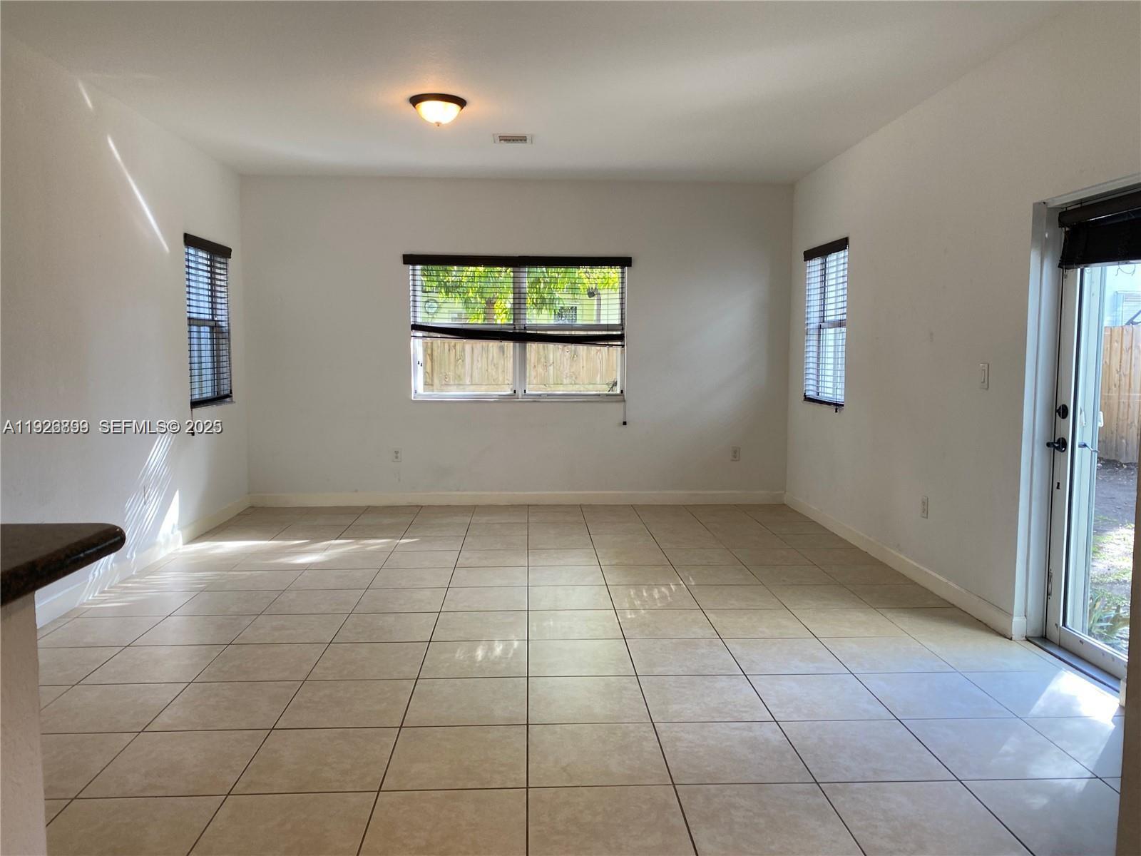 3616 Northeast 3rd Court Homestead, FL 33033 - Photo 6 of 11 a view of an empty room with a window
