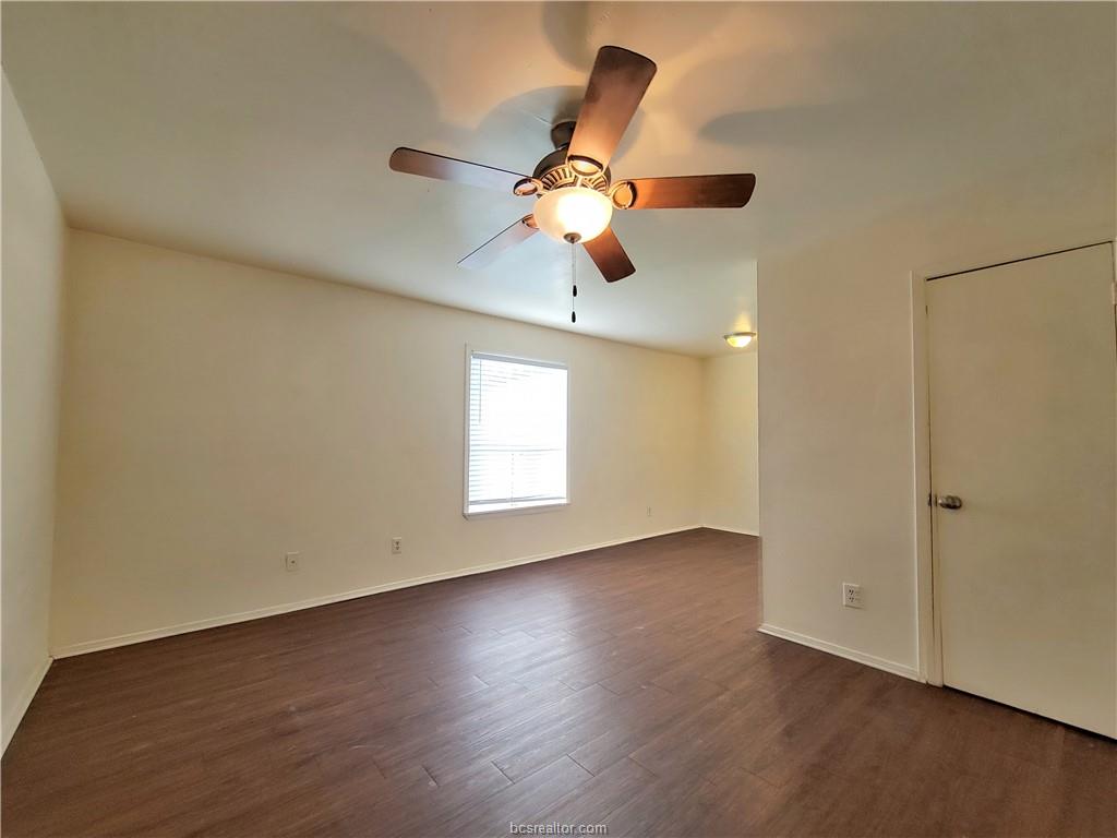 2712 Evergreen Circle Bryan, TX 77801 - Photo 29 of 30 Spare room featuring ceiling fan and dark hardwood / wood-style floors