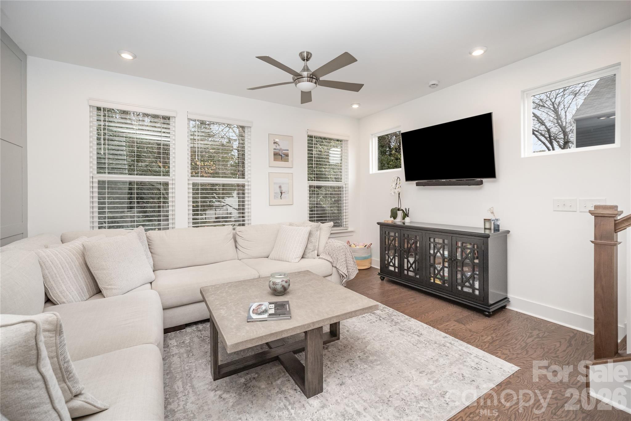 4004 Capital Ridge Charlotte, NC 28205 - Photo 11 of 30 a living room with furniture a flat screen tv and a flat screen tv