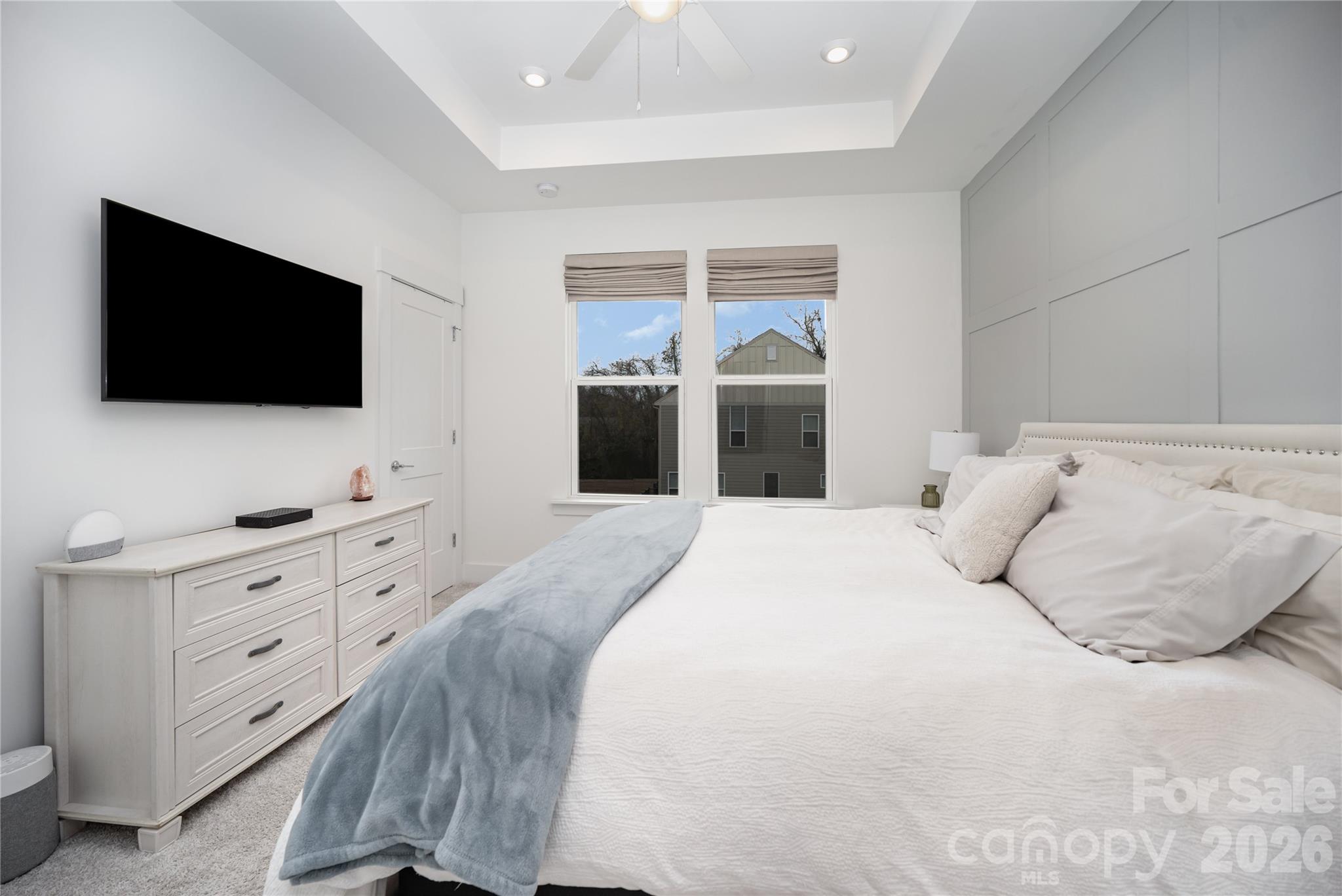 4004 Capital Ridge Charlotte, NC 28205 - Photo 16 of 30 a bedroom with a large bed and a flat screen tv