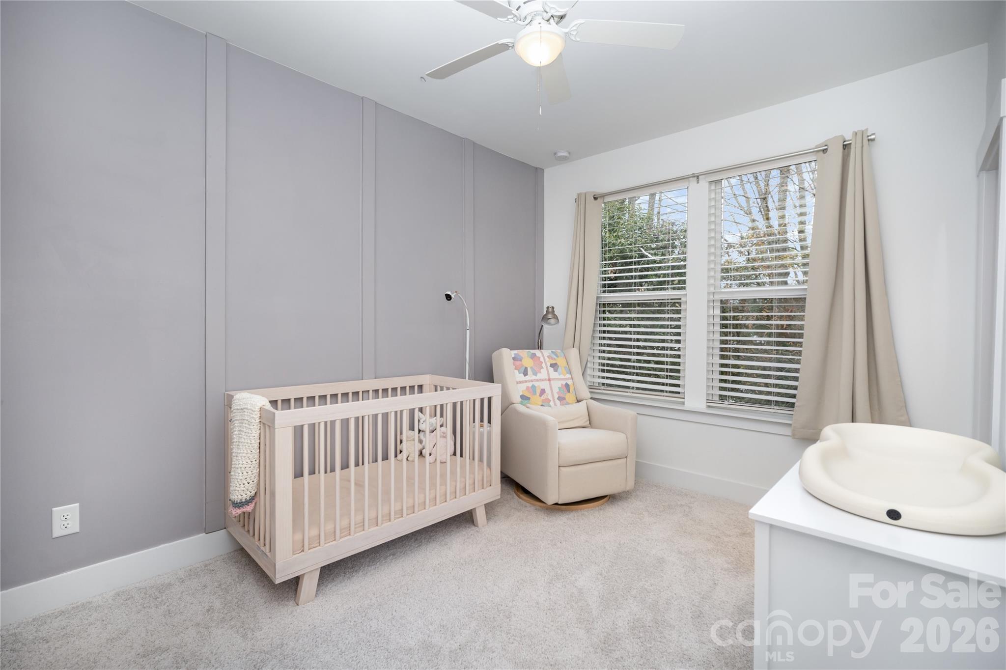 4004 Capital Ridge Charlotte, NC 28205 - Photo 20 of 30 a bedroom with a bed and a window