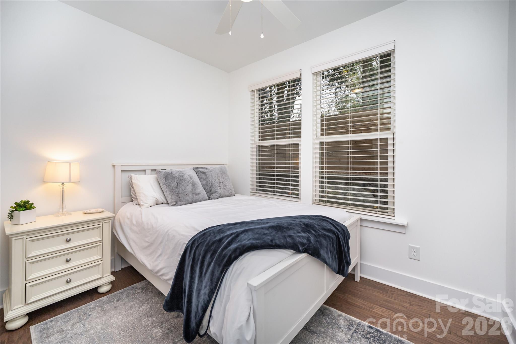 4004 Capital Ridge Charlotte, NC 28205 - Photo 23 of 30 a bedroom with a bed and a window