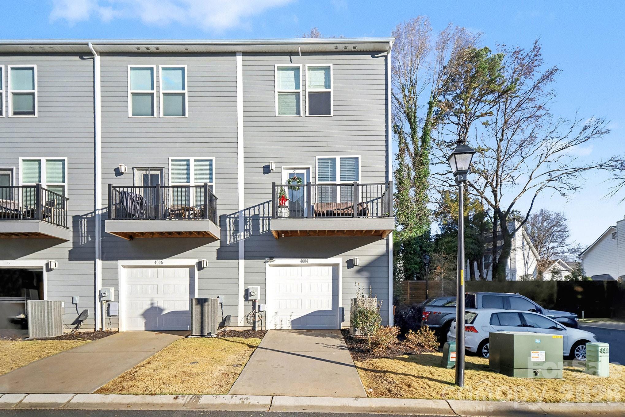 4004 Capital Ridge Charlotte, NC 28205 - Photo 30 of 30 a view of a patio with couches table and chairs under an umbrella