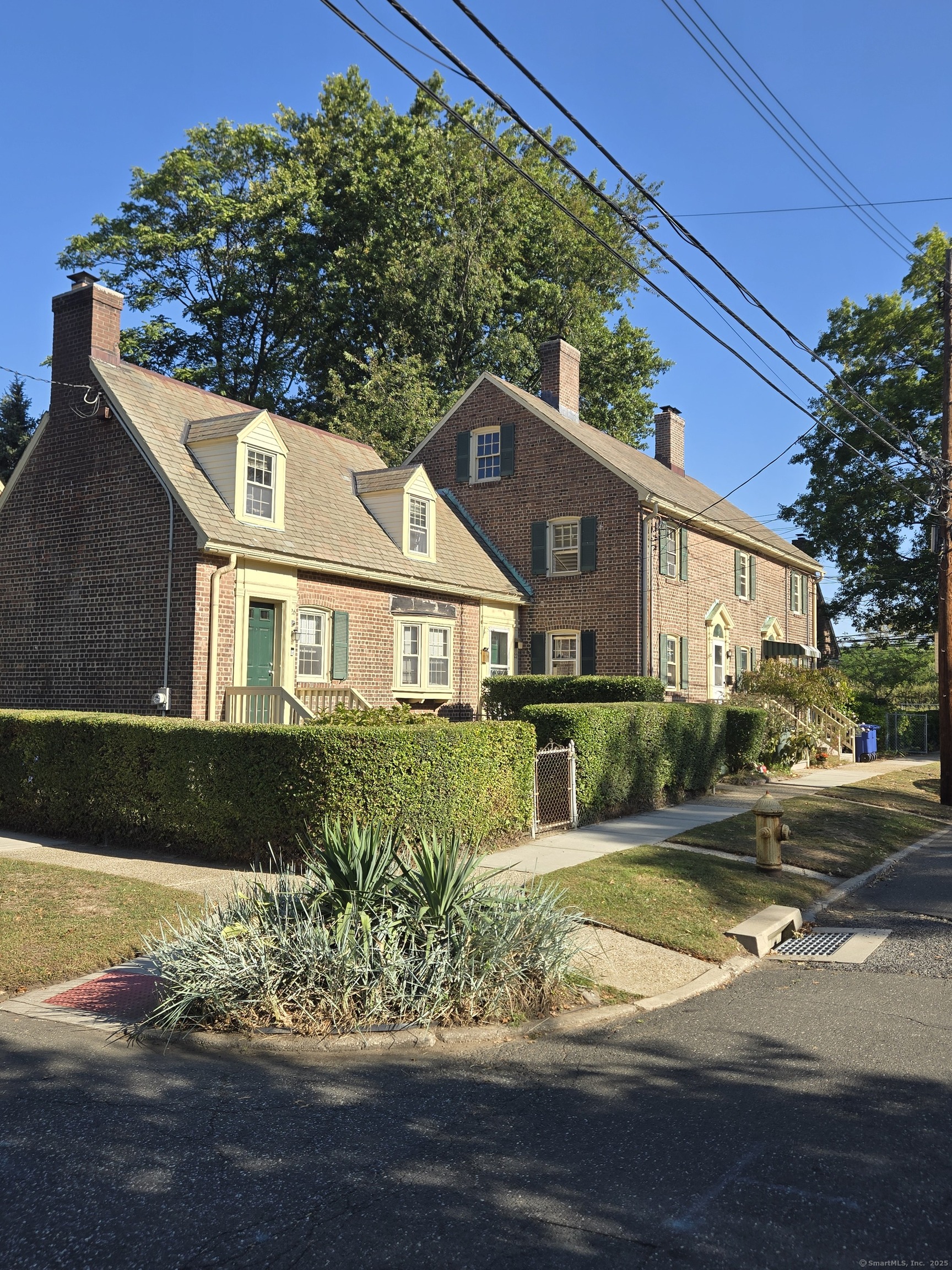 21 Little Street Bridgeport, CT 06604 - Photo 4 of 12 a front view of a house with a yard