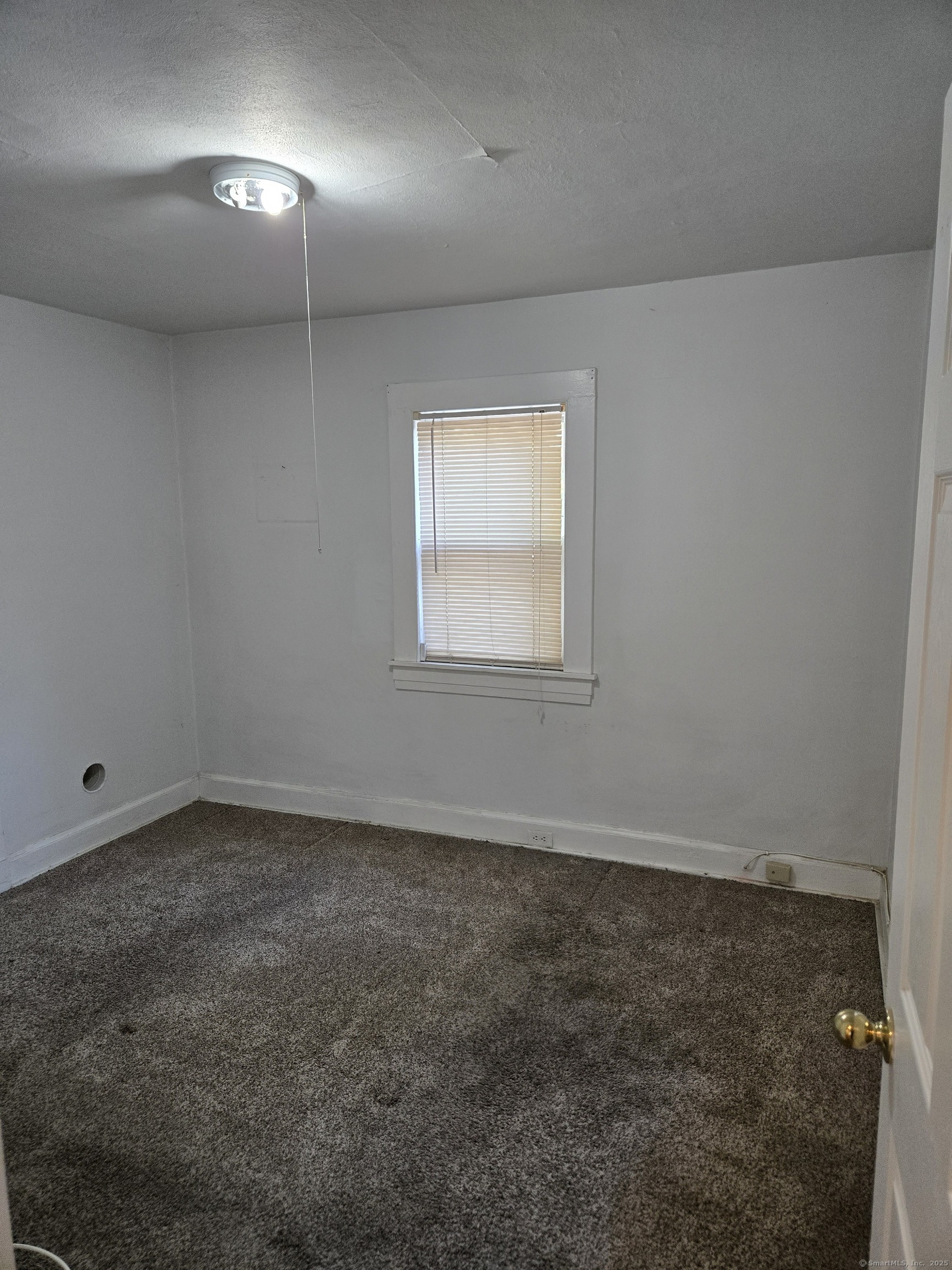21 Little Street Bridgeport, CT 06604 - Photo 7 of 12 an empty room with a empty space and windows