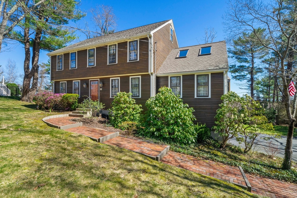 51 Outlook Road Marshfield, MA 02050 - Photo 3 of 38 a front view of a house with yard and green space
