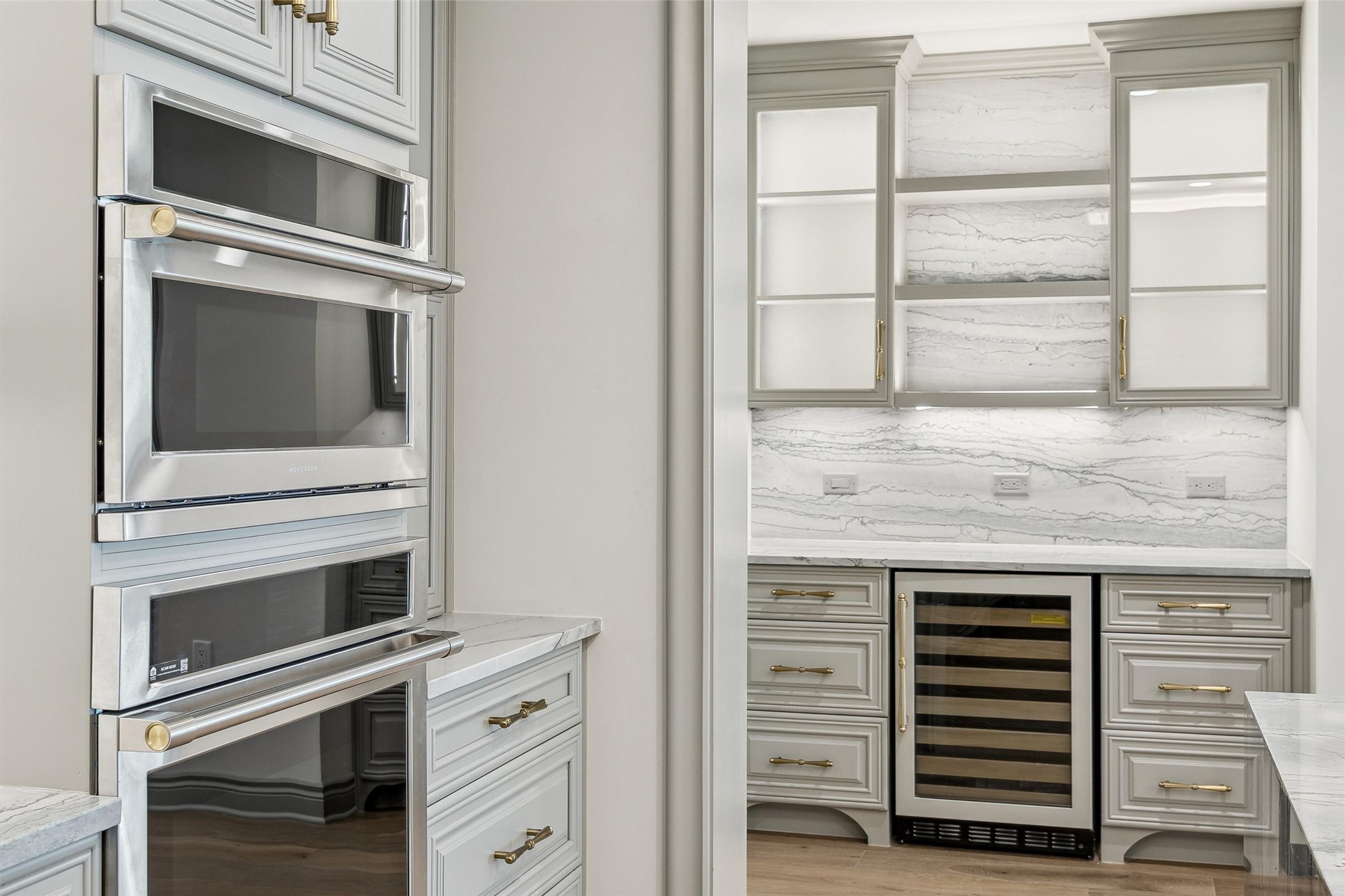 1717 Bissonnet Street, Unit 1802 Houston, TX 77005 - Photo 8 of 46 GE Monogram and Wolf appliances, custom cabinetry and brass hardware.
