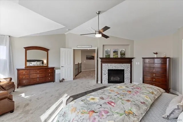 a bedroom with a bed and a fireplace