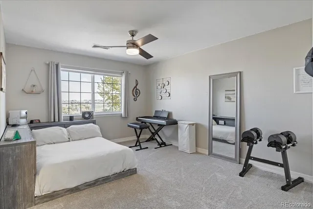a bathroom with a granite countertop sink a mirror and a shower