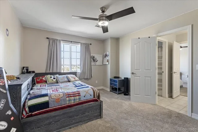 a bed sitting in a room next to a window