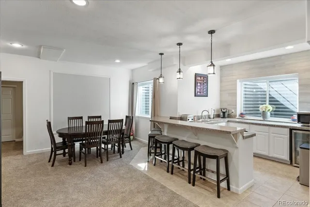 a kitchen with a sink and a refrigerator