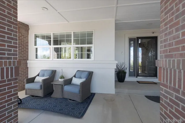 a view of a patio with table and chairs and potted plants