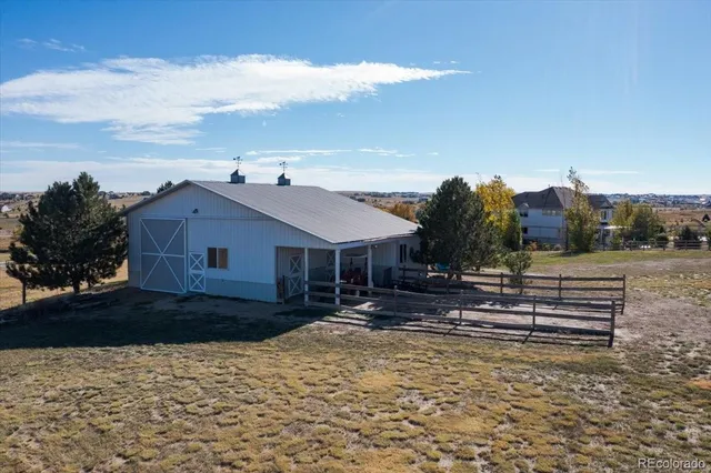 a view of a garage with parked cars