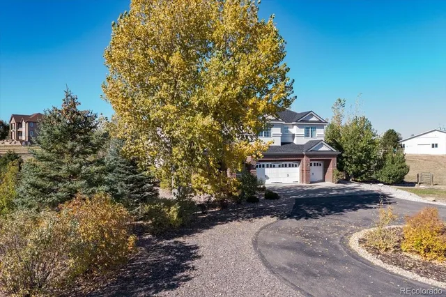 a view of a house with a snow in the yard