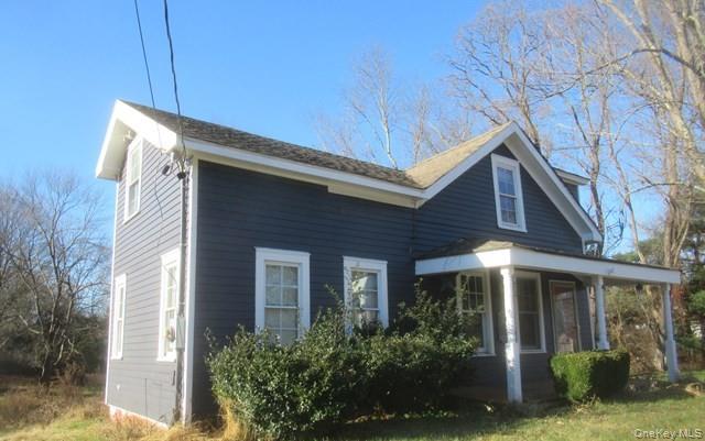 91 Clove Branch Road Hopewell Junction, NY 12533 - Photo 1 of 8 a front view of a house with garden