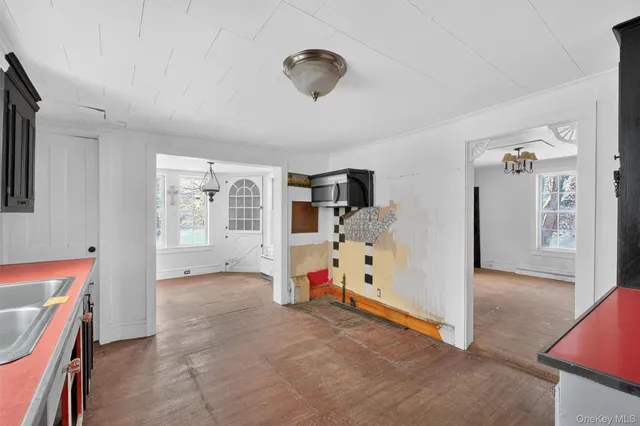 a view of empty room with windows