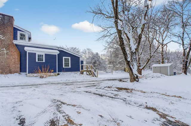 a view of snow on the side of the road