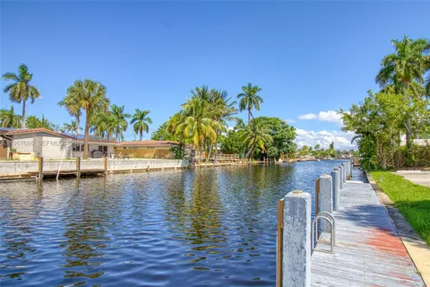 a view of a swimming pool with a lounge chair