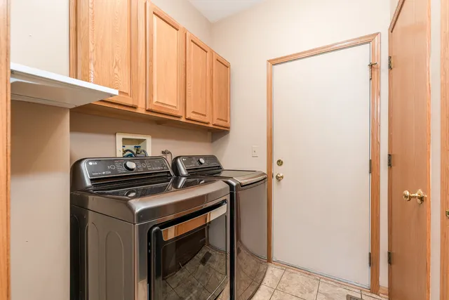a kitchen with stainless steel appliances granite countertop a stove and a refrigerator