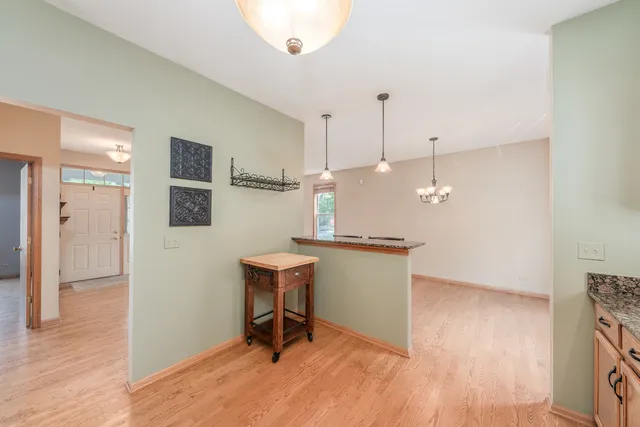 a room with a table and chairs